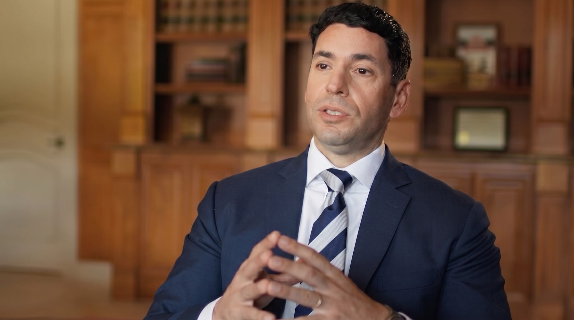 Chris Corzo, founder of Chris Corzo Injury Attorneys, speaking in his office